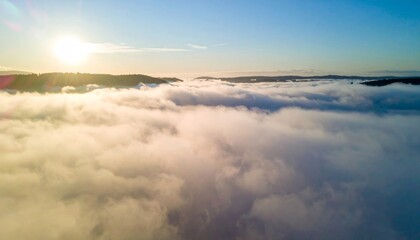 Aerial View of Soft White Clouds with Bright Sunlight and Blue Sky Scenery