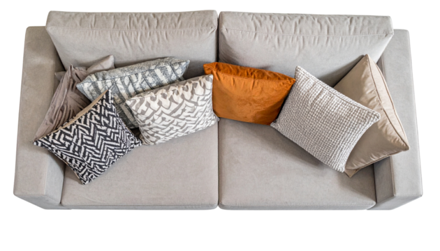 Overhead shot of a comfy light gray sofa with assorted throw pillows in various colors and textures - Powered by Adobe