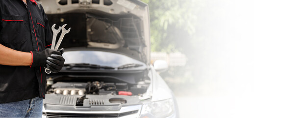 Auto mechanic holding wrench for fix service repairing and car care maintenance servicing change spare part engine problem or insurance support or range of car check or training workshop.