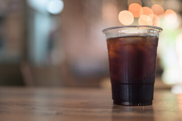 Iced black coffee americano served on table in cafe restaurant