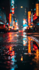 Obraz premium Vibrant neon reflections shimmer on wet city streets at night, creating a dazzling urban spectacle