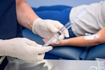 Nurse or doctor inserting IVC cannula into vein of patient, for IV fluids and medication, gp general practice australia, medical healthcare clinic