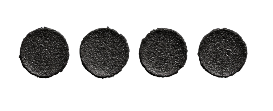 Five dark circular shapes with textured surfaces