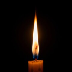 Single candle flame burning brightly in the dark creating a warm and peaceful atmosphere.