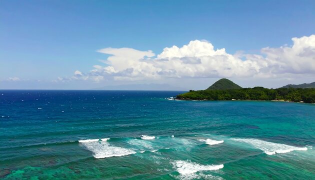 Turquoise ocean waves break gently near a tropical island under a clear sky - Powered by Adobe