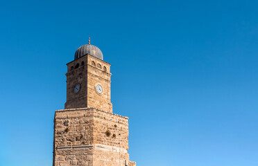 Fototapeta premium The historic clock tower in front of the deep blue sky in Antalya