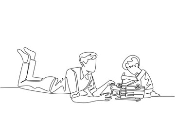 Single continuous line drawing a man lying on the floor accompanying a boy who is fixing a toy car. Training children to be independent. Child Care Provider Day. One line design vector illustration
