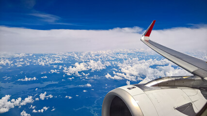 beautiful white clouds in nature blue sky in sunny day, view from a plane, look over South China Sea.