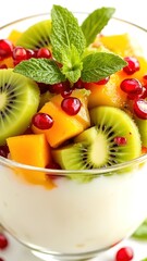 Fresh Colorful Fruit Salad with Kiwi, Mango, Pomegranate and Mint