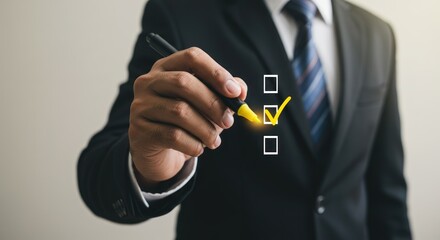 Business person holding pen marks a check box in a form.