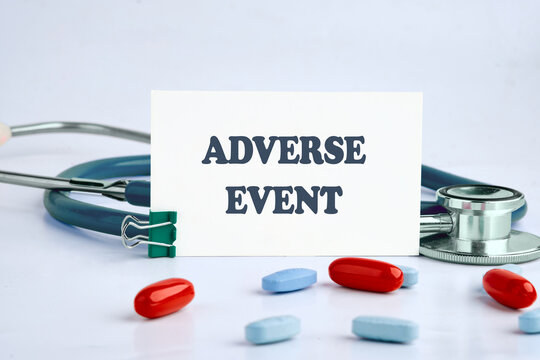 Medicine concept. ADVERSE EVENT written on a blue background on a white business card. Conceptual image