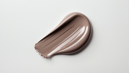 Obraz premium Smudge of taupe cosmetic texture beautifully presented on white background