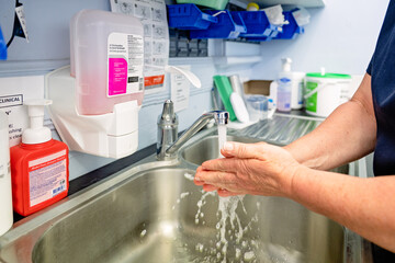Nurse washing hands in medical clinic hospital