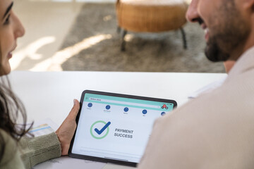 close up Couple using tablet and credit card to shop online through e-commerce app, making payment and browsing modern platform with promo codes and discount offers