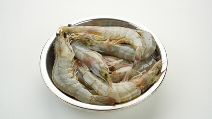 Fresh shrimps on stainless bowl, food preparation.