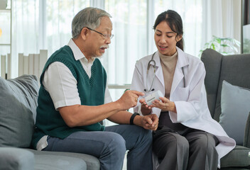 Doctor Explaining Medication to Senior Patient During Medical Consultation