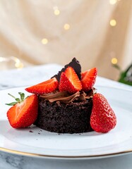 Chocolate brownie dessert topped with whipped cream and fresh strawberries