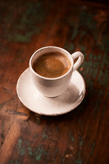 Cup of coffee on wooden background. Soft focus. Copy space	