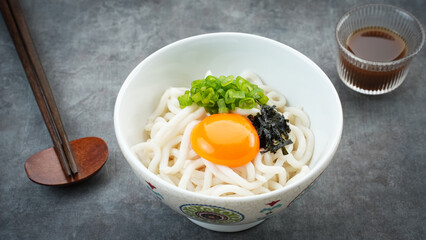 Udon Noodles with egg yolk and dashi soup, japanese food