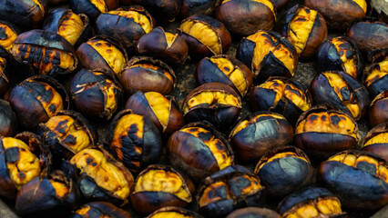 Fresh fried chestnuts on the streets of Istanbul. Turkish street food. Fast food. National cuisine 