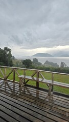 Fototapeta premium Beautiful view of Lago Ranco in Chile on a cloudy day, with calm waters, mountains, and forested shores creating a peaceful natural landscape.
