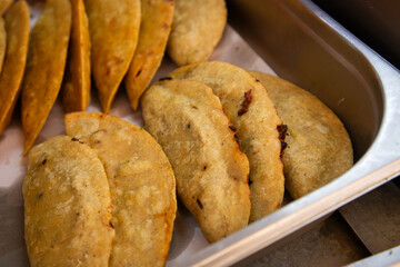 Street food stand serving fried tamales, gorditas and empanadas in Mexico City.