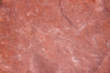 Red stone wall texture with rough vintage surface