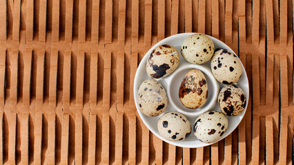 Speckled quail eggs nestled on rustic lattice evoke rebirth folklore, Easter narratives, and artisanal gourmet gatherings