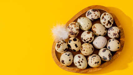 Quail eggs nestled in a rustic wooden heart, whispering Easter renewal, fertility folklore, and foraging fame against vibrant yellow