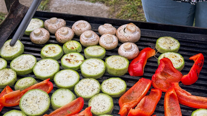 Grilled vegetables sizzle in harmonious alchemy, invoking flavors of midsummer Litha feast and...