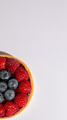 Juicy roundel of vibrant berries nestling in pastry, invoking Berry Festival nostalgia and autumnal equinox celebrations