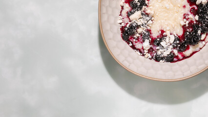 Creamy porridge crowned with a symphony of berry compote, echoing Nordic Midsummer feasts and hygge tranquility quests
