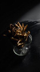 Intricate gilded artichoke, shadow play, surreal elegance, harvest festival, steampunk aesthetics, enigmatic culinary mystery in glass