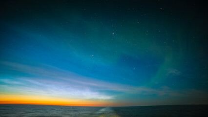 Noctilucent Clouds and faint Northern Lights, off the Coast of Iceland August 2025. 
