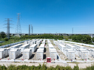 Aerial view of battery energy storage systems under a clear blue sky