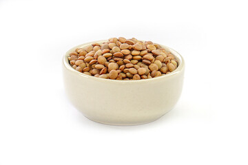 Vicia lens or Lens culinaris (Lens culinaris). Lentils brown, contains protein and soluble fiber, is a source of vitamin B.in a bowl on a white background.