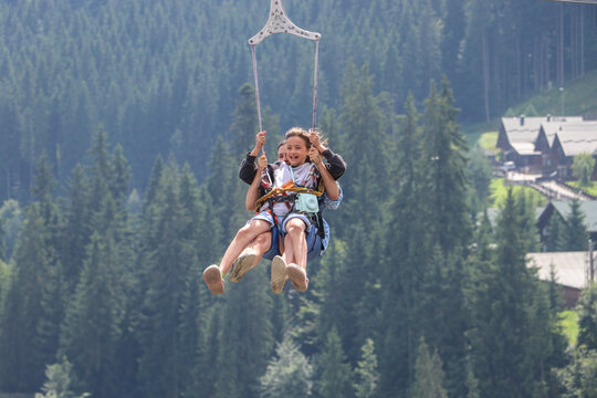Childs joy in flight. Zipline over the mountains.