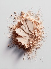 Light beige powder scattered on a light background