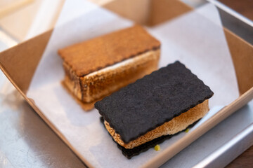 Smore, a toasted marshmallow and chocolate sandwiched between crackers