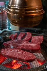 Hanwoo Beef, Korean Style Meat on the Grill. BBQ rare meat with soft focus