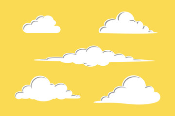Cartoon clouds floating in a bright yellow sky creating a cheerful atmosphere
