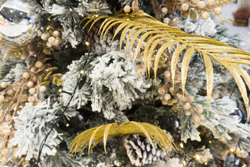 Decorated Christmas tree on blurred background.