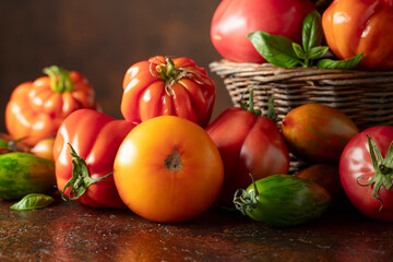 Tomatoes on a brown background.