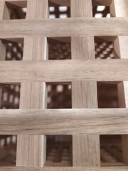 Detailed close-up of intricate wooden lattice structure for versatile use