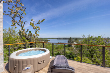 Outdoor inflatable  jacuzzi with river view