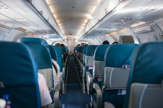 Interior view of airplane cabin with row of seats