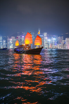 Traditional chinese junk sail at night, Hong Kong harbour