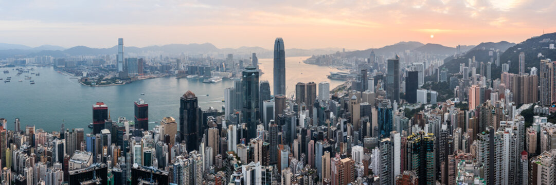 Hong Kong skyline and harbor panoramic at sunrise