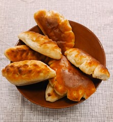 Freshly baked pastries in a rustic style in golden-brown and earthy tones representing home comfort and delicious food