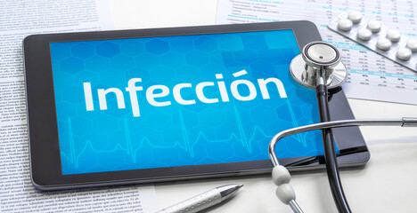 A tablet with the word Infectious disease in spanish on the display